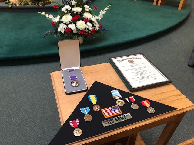 Family members of Sgt. Gerald Raeymacker were presented with his honors and medals during services.